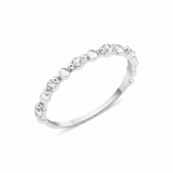 white gold heart band ring on white background