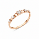 rose gold graduated stone ring on white background