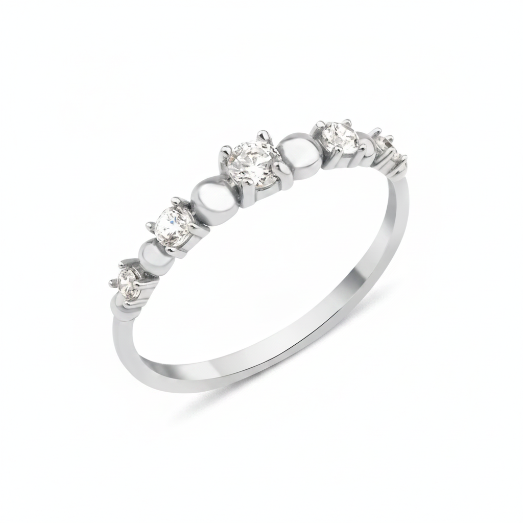 white gold graduated stone ring on white background