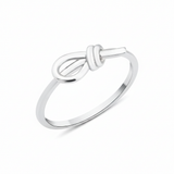white gold knot ring on white background