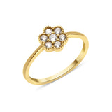 yellow gold floral cluster ring on white background