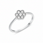 white gold floral cluster ring on white background