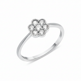white gold floral cluster ring on white background