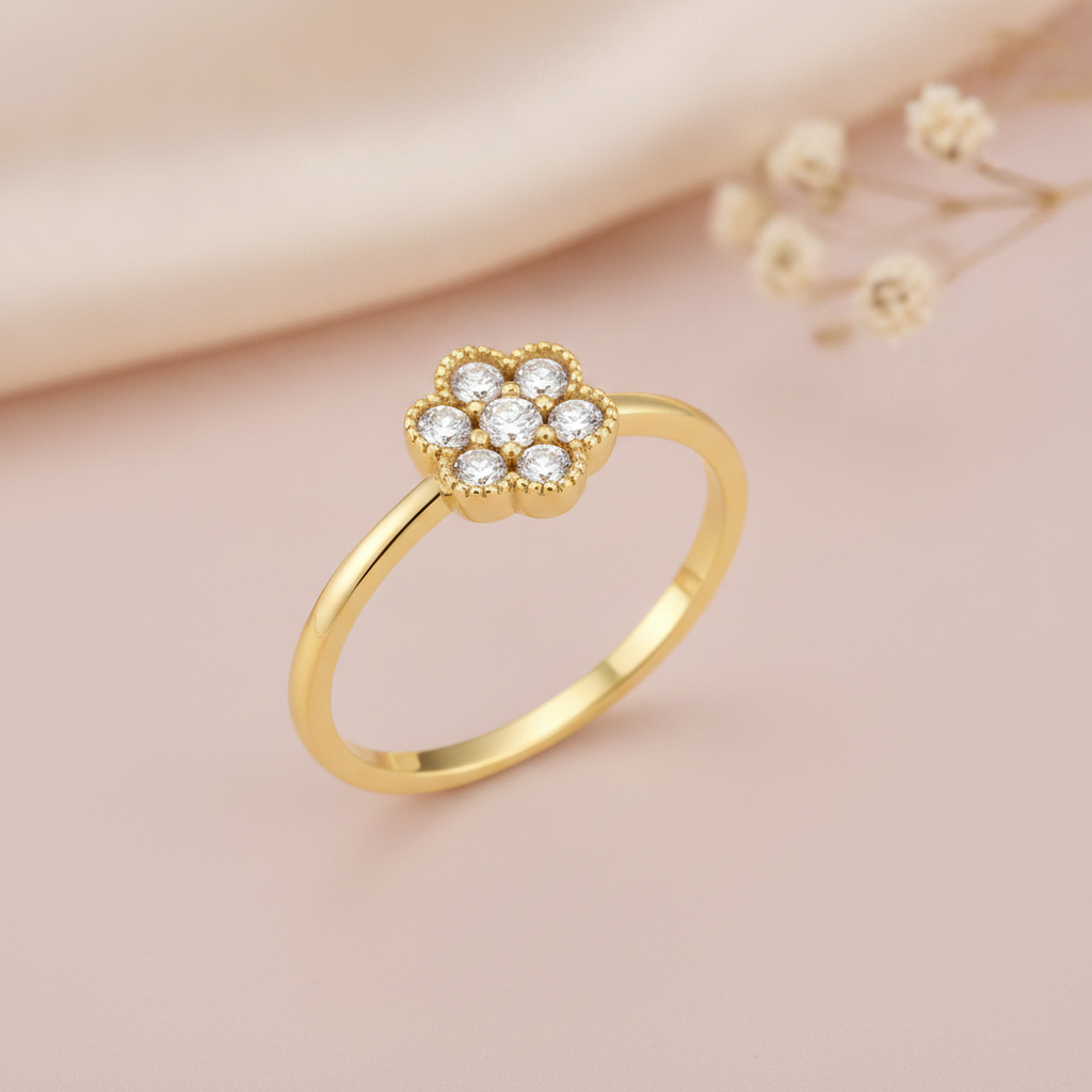 gold floral cluster ring displayed on pink satin with dried baby's breath